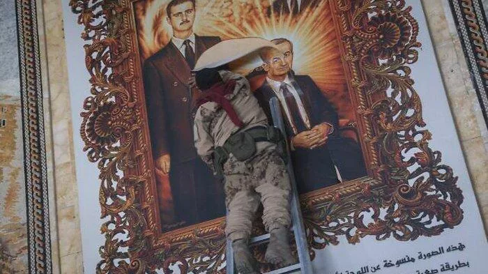 Pasukan Oposisi Merobek Lukisan Presiden Bashar Al Assad
